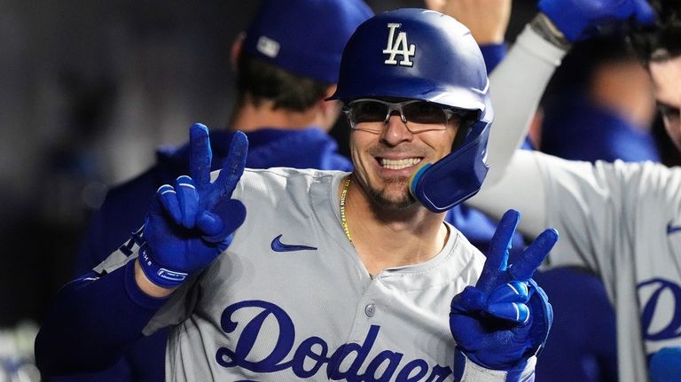 Los Angeles Dodgers' Kike Hernández (8) flashes a smiles after...