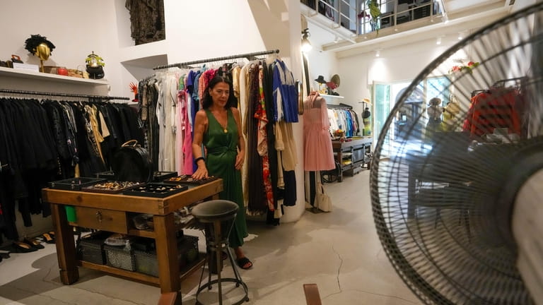 Floriana Peroni walks in her vintage clothing store in downtown...