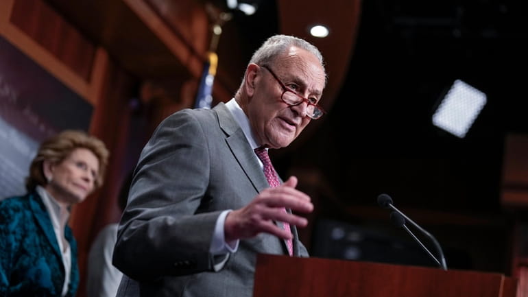 Senate Majority Leader Chuck Schumer, D-N.Y., joined at left by...