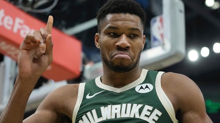 Milwaukee Bucks' Giannis Antetokounmpo reacts after being fouled during the...