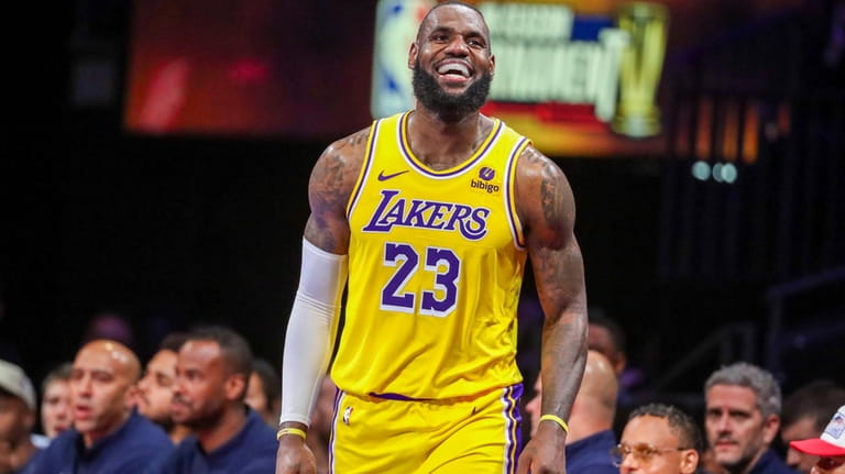 Los Angeles Lakers forward LeBron James (23) smiles after being...