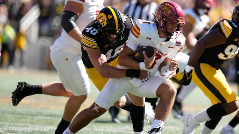 Iowa State quarterback Rocco Becht (3) is sacked by Iowa...