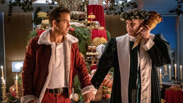 Ryan Reynolds and Will Ferrell in "Spirited," premiering November 18,...