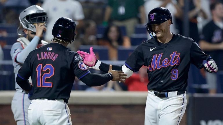 Brandon Nimmo of the Mets celebrates his fourth-inning three-run home run...