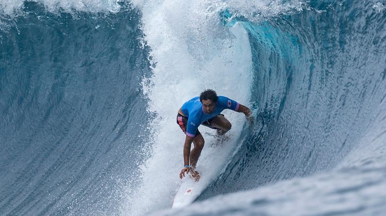 Japan's Connor O'Leary rides a wave during round three of...