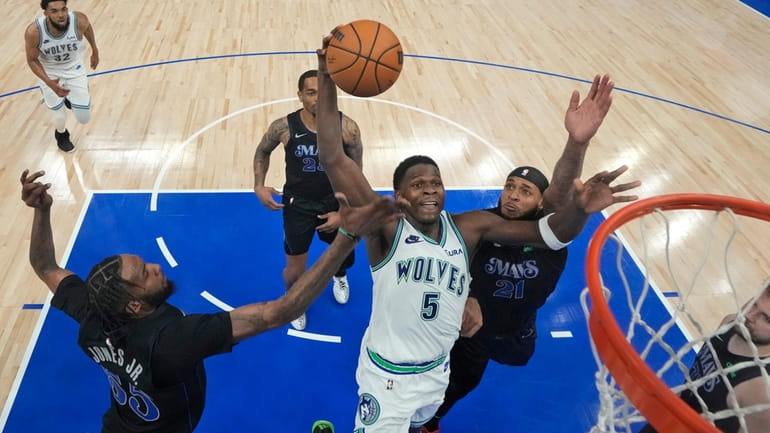 Minnesota Timberwolves guard Anthony Edwards (5) goes up for a...