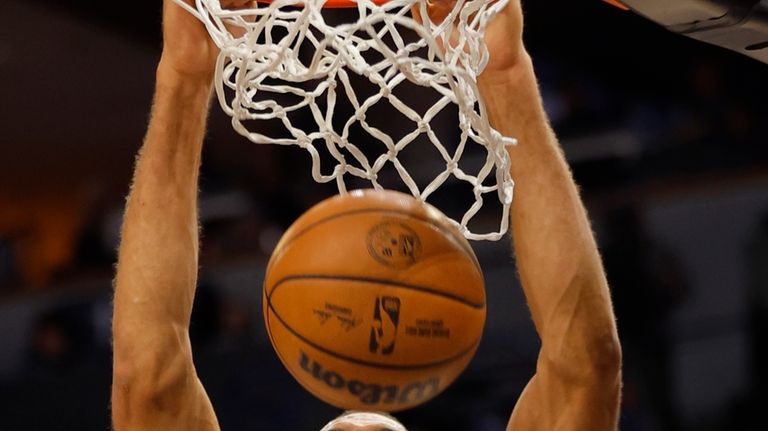 Minnesota Timberwolves center Rudy Gobert dunks against the Portland Trail...