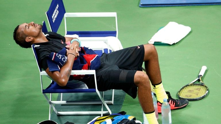 FILE -Nick Kyrgios, of Australia, rests on his chair before...