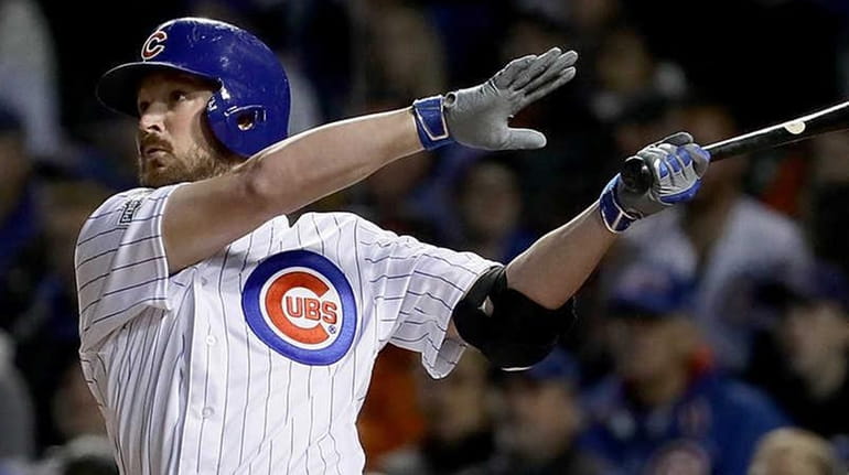 Travis Wood of the Chicago Cubs hits a home-run in...