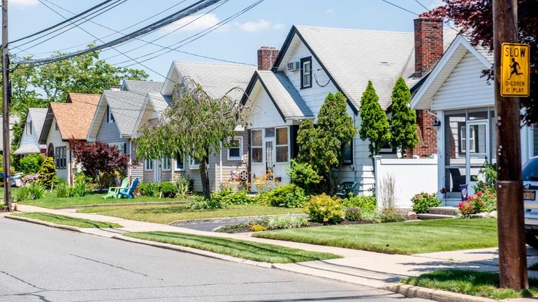 Homes along Rolling Street in Malverne, which has a variety...