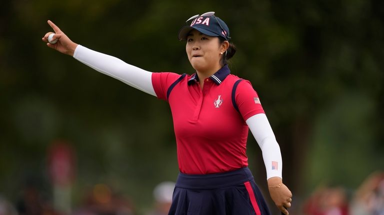 United States' Rose Zhang celebrates after winning a foursomes match...