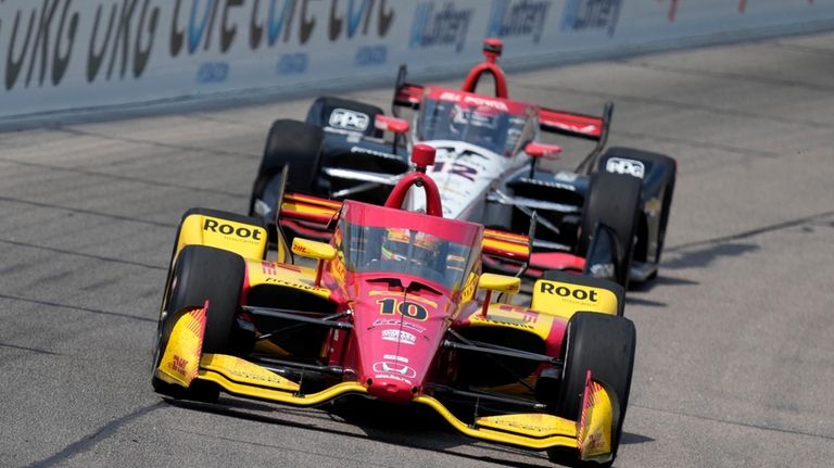 Alex Palou (10) leads Will Power during an IndyCar auto...