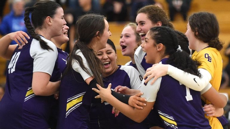 Oyster Bay teammates celebrate after their 3-1 win over Wheatley...