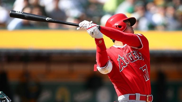 Shohei Ohtani bats against the Athletics on March 29, 2018...