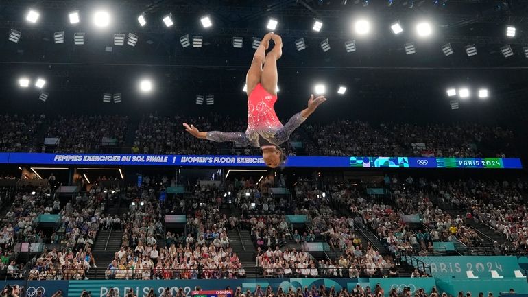 Simone Biles, of the United States, competes during the women's...