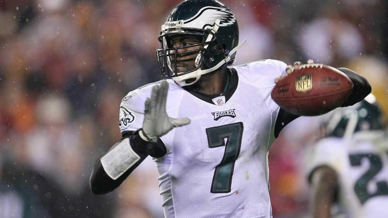 Michael Vick #7 of the Philadelphia Eagles throws a pass...