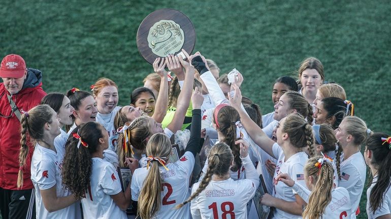 Sacred Heart celebrates its victory over St. Joseph by-the-Sea in...