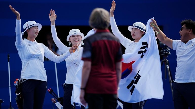 South Korea's Lim Si-hyeon, center, Jeon Hun-young, left, and Nam...