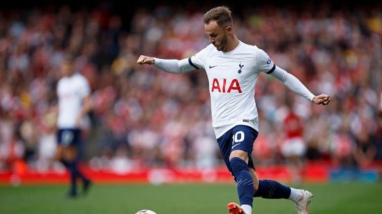 Tottenham's James Maddison runs with the ball during the English...