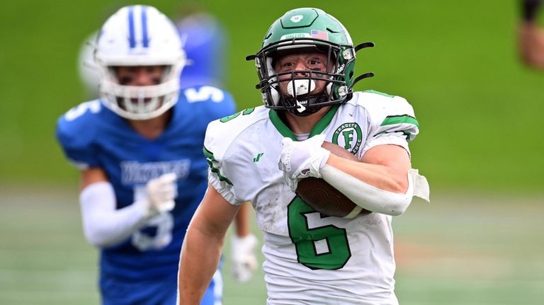 Farmingdale's Sal Posillico runs for a touchdown during a Nassau Conference...