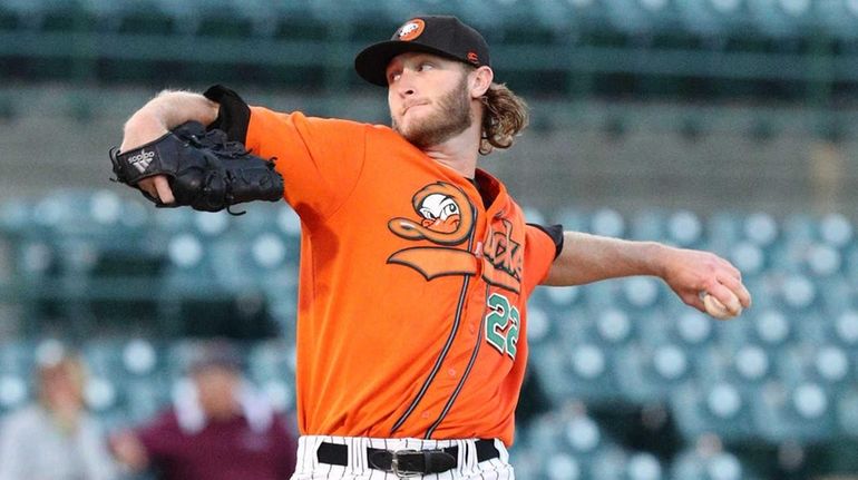 Long Island Ducks starter Jarret Leverett #22 pitches during the...