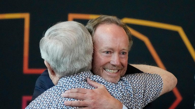 New Phoenix Suns head coach Mike Budenholzer, right, gets a...