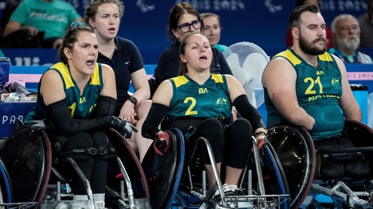 Australians Ella Sabljak, left, Emilie Miller, center, and Josh Nicholson...