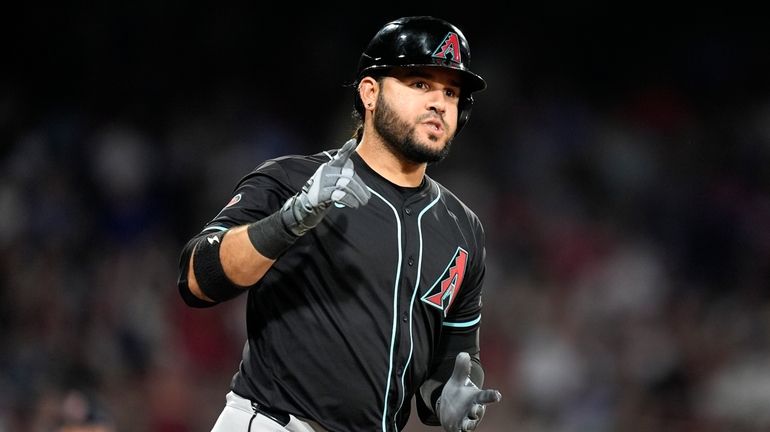 Arizona Diamondbacks' Eugenio Suárez runs on his grand slam during...