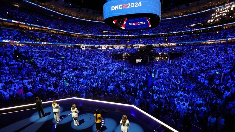 Rep. Lucy McBath, D-Ga., stands onstage and is joined by...