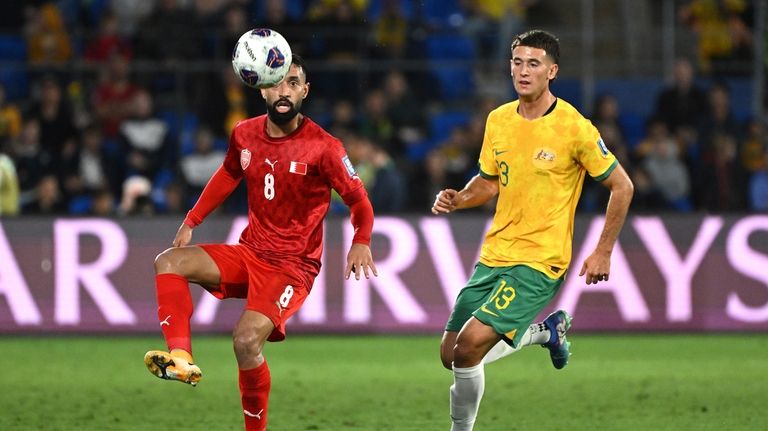 Bahrain's Mohamed Marhoon, left, competes with Australia's Alessandro Circati for...