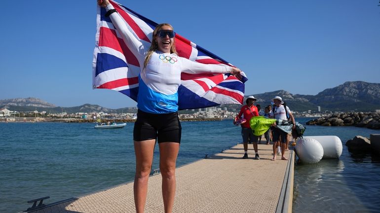 Ellie Aldridge of Britain celebrates after winning the women's kite...