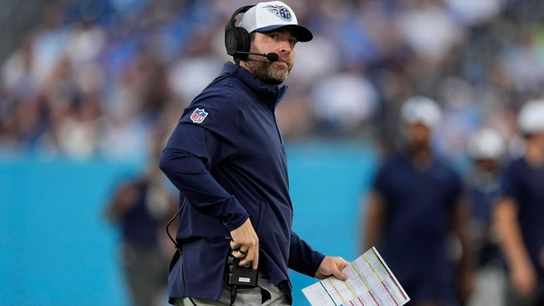 Tennessee Titans head coach Brian Callahan watches from the sideline...