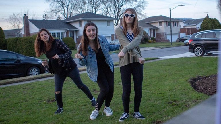 Plainview's Jennifer Gutterson, left, and daughters, Alexa, center, 16, and Ava,...