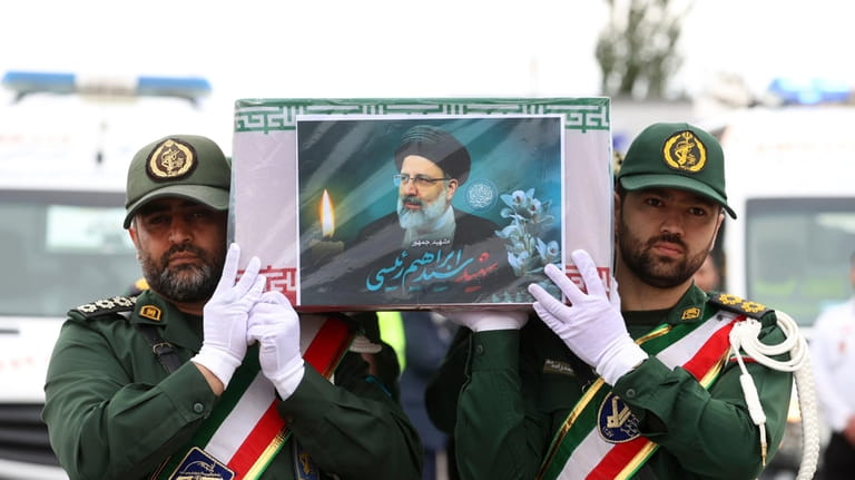 In this photo released by the Iranian Presidency Office, Revolutionary...