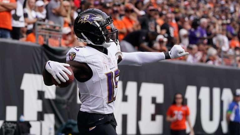 Baltimore Ravens wide receiver Nelson Agholor (15) celebrates after scoring...