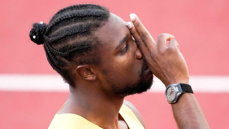 Noah Lyles celebrates after winning the men's 200-meter final during...