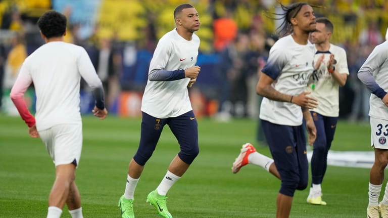 PSG's Kylian Mbappe warms up before the Champions League semifinal...