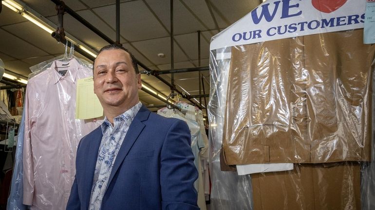 Leonardo Estevez, a Hispanic business owner, in front of his...