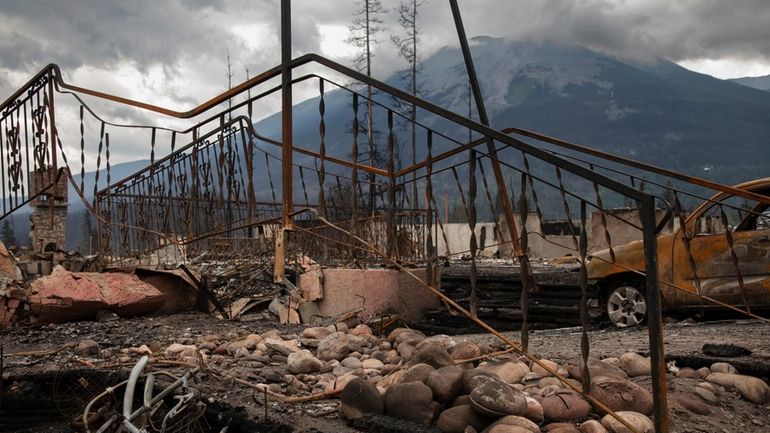 Damage is seen after a wildfire in Jasper, Alberta, Friday...