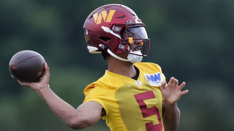 Washington Commanders quarterback Jayden Daniels throws a pass during an...