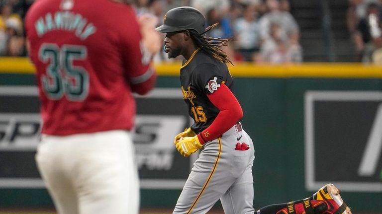 Pittsburgh Pirates' Oneil Cruz runs the bases after hitting a...