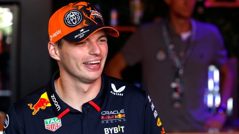 Red Bull driver Max Verstappen of the Netherlands smiles after...