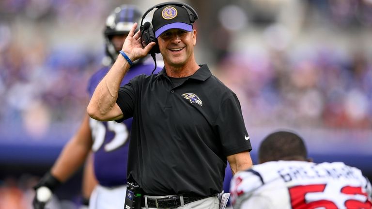 Baltimore Ravins head coach John Harbaugh smiles during the second...