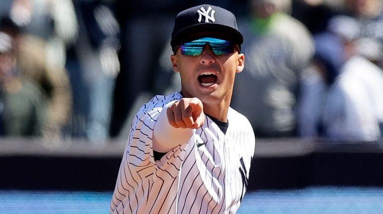 Anthony Volpe of the Yankees reacts after the final out of...