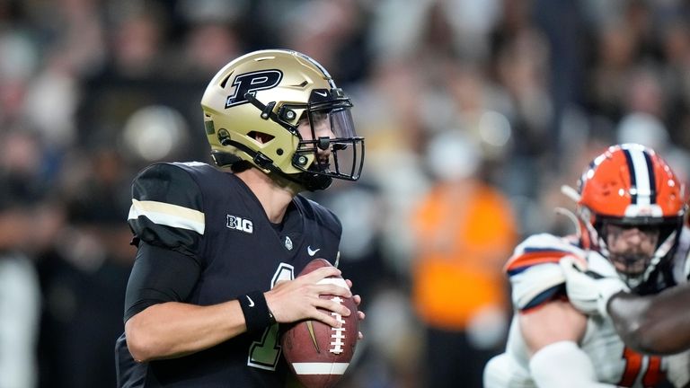 Purdue quarterback Hudson Card (1) looks for a receiver during...