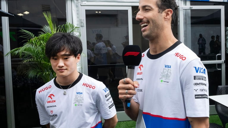 Visa Cash F1 drivers Yuki Tsunoda, left, from Japan, and...