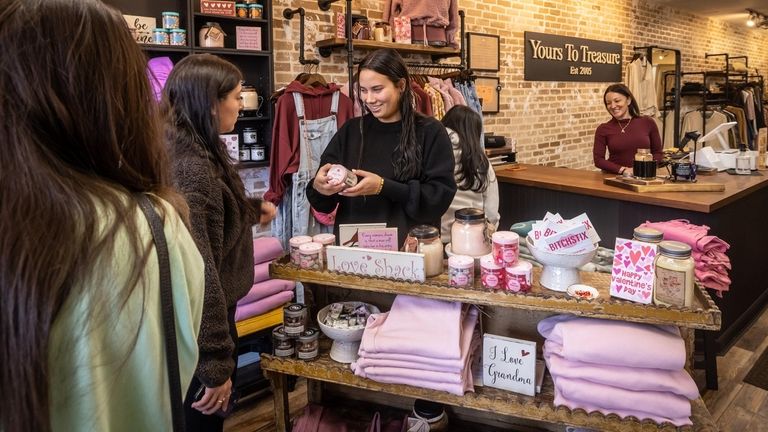 Customers browse the gifts and items at Yours To Treasure,...