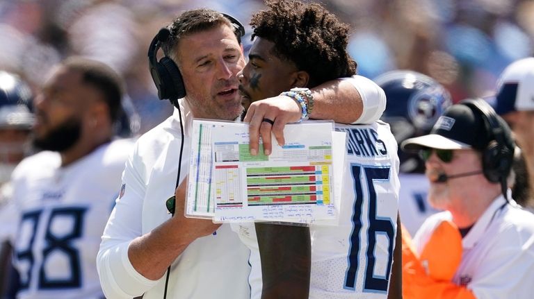 Tennessee Titans head coach Mike Vrabel talks to wide receiver...