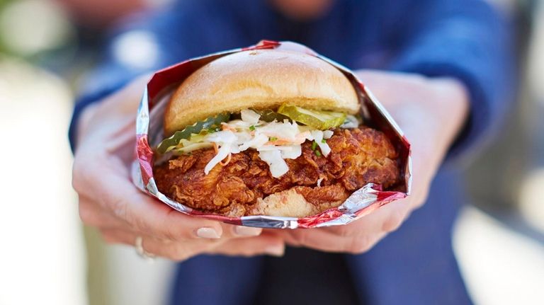 The Nashville hot fried chicken sandwich with spicy glaze, pickles,...