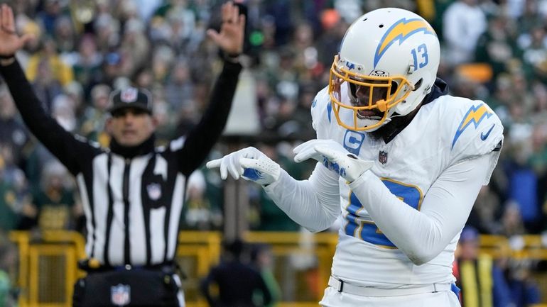 Los Angeles Chargers wide receiver Keenan Allen reacts after catching...